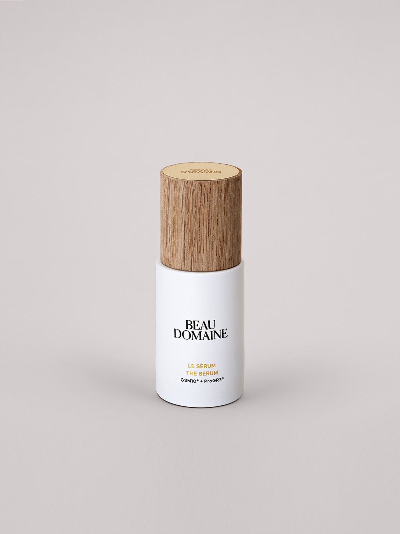White bottle with wooden cap on a light gray background